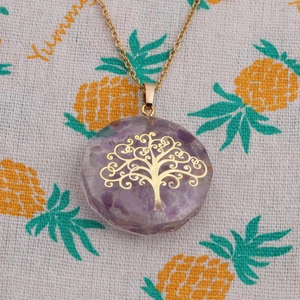 Detail of life of tree gold pendant necklace with purple amethyst chips in resin