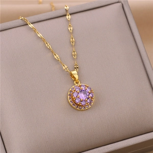 Rotating gold titanium necklace with a vibrant purple zircon pendant in a floral sunburst design