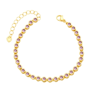 Detail of gold tennis bracelet featuring purple round stones and a heart charm extension