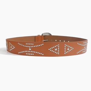 Detail of genuine leather brown belt with silver rivets and embossed branding inside