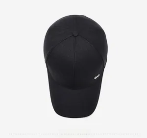 Top view of a black cotton baseball cap showing structured crown and metal logo plate
