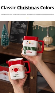 Close-up of festive ceramic Santa and Snowman square mugs with red handles for Christmas