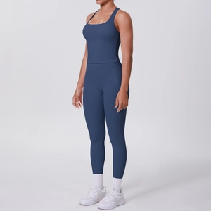 Detail of high-stretch navy yoga set with racerback top and high-waisted leggings
