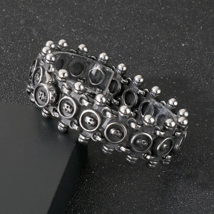 Men's gothic punk skull V-shaped chain bracelet in silver finish on dark background