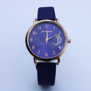 Fashionable moon and star quartz watch for women with blue strap and rose gold case
