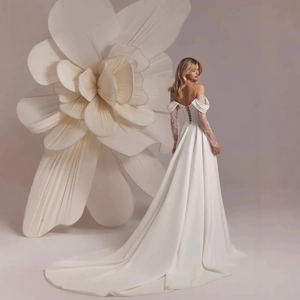 Elegant off-the-shoulder long sleeve wedding dress with lace embroidery and cathedral train