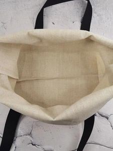 Top view of the spacious inner structure and coarse canvas texture of this tote bag