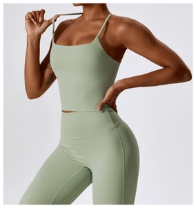 Detail of mint green yoga set with thin strap square neck top and high waisted leggings