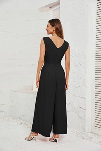 Side-back view of a black sleeveless wide-leg jumpsuit with deep V back and crepe texture