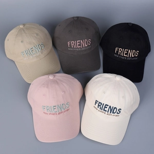 Top view of multi-color baseball caps featuring embroidered Friends lettering design