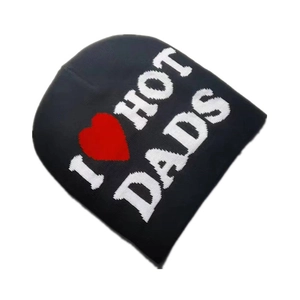 Detail shot of black knit beanie featuring 'I Love Hot Dads' embroidered text and red heart