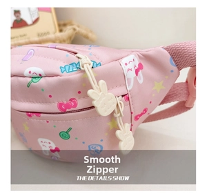 Close-up of pink cartoon fanny pack with rabbit-shaped zipper pull and smooth zip