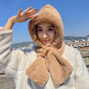 Close-up of plush khaki hooded scarf with soft faux rabbit fur and leather sport tag