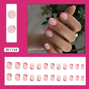Short round French tip press-on nails in vibrant pink and white color block design