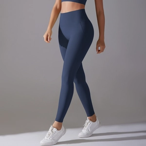 Detail of high-waist navy blue yoga leggings showing seamless texture and slimming fit