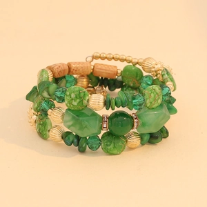 Multilayer bohemian beaded bracelet featuring green stone beads and golden metal accents