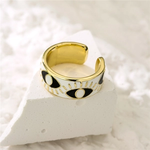 Detailed close-up of adjustable 18K gold-plated evil eye ring with white enamel finish