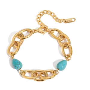 Titanium steel bracelet with gold chunky links and turquoise teardrop charms on white background
