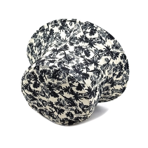 Detail view of tropical palm tree print on black and white canvas bucket sun hat