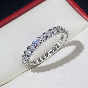 Macro view of full eternity silver ring with round-cut sparkling cubic zirconia stones