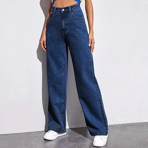 Full view of dark blue high-waisted wide-leg denim jeans on a model with a clean background