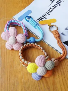 Handwoven flower phone wrist strap with sturdy spring hook and adjustable colorful cord