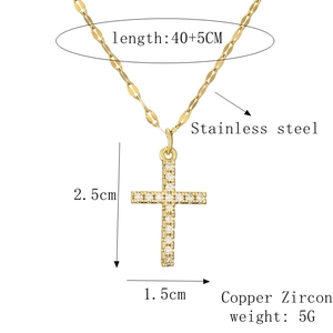 Detail showing cross pendant dimensions 2.5x1.5cm with adjustable stainless steel chain