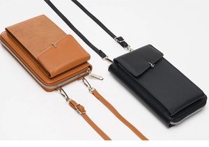 Detail of brown and black textured faux leather crossbody phone bags with silver zippers