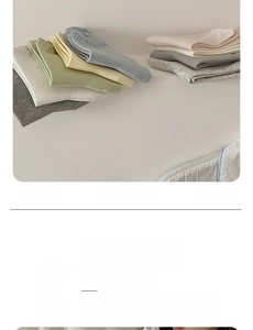 Macro shot of assorted colorful cotton socks in Morandi pastel tones on a neutral surface