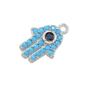 Hip-hop Hamsa hand pendant with light blue micro-inlaid rhinestones and a dark eye gem