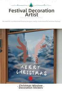Close-up of red reindeer antlers and Merry Christmas text on a static glass window sticker