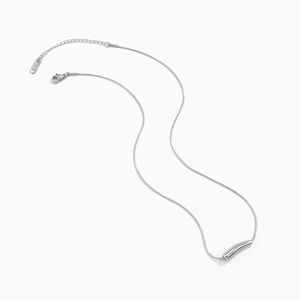 Macro shot of silver S925 sterling silver snake chain necklace with curved tube pendant