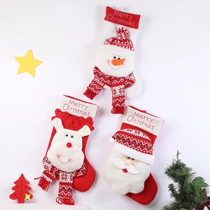 Large Christmas stockings set featuring plush Santa, reindeer, and snowman figurines
