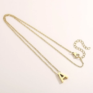 Detail of gold letter A pendant necklace showing fine chain and secure lobster clasp