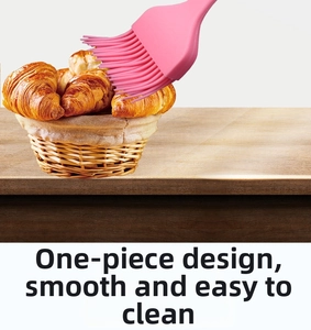 Pink one-piece silicone baking brush with dense bristles for kitchen pastry oiling