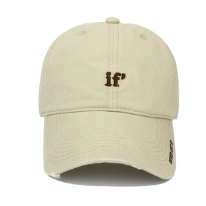 Detail of light beige cotton baseball cap with IF embroidery and distressed brim edge