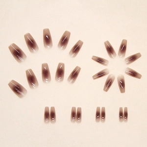Glossy long ballerina press-on nails with rose blush gradient in 24 pieces set