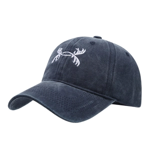 Classic washed blue baseball cap with white antler embroidery and a vintage distressed look