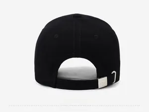 Rear view of black cotton baseball cap showing adjustable strap and metal buckle