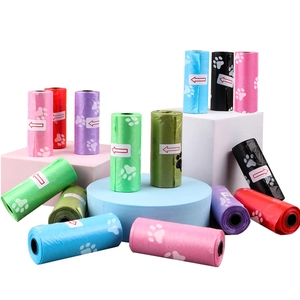 Close-up of biodegradable pet waste bags with paw prints in various vibrant colors