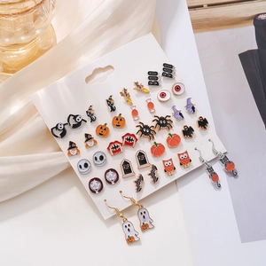Detailed view of Halloween earring set with pumpkin, ghost, and spider motifs on cards