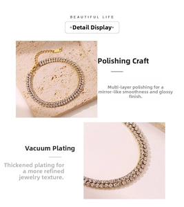 Detail of gold double-row zircon chain with polished stainless steel finish