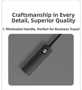 Detail of automatic black umbrella handle with ergonomic button for business travel
