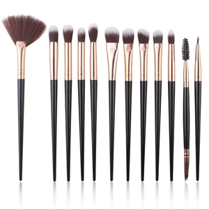 12-piece makeup brush set with black handles and rose gold tubes on white background