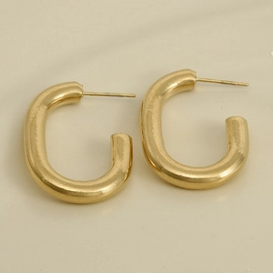 Detailed view of gold C-shaped stainless steel earrings with a polished metallic finish
