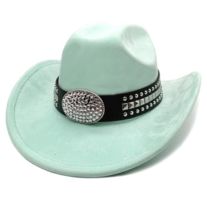 Detail of mint green suede cowboy hat with studded leather band and rhinestone buckle