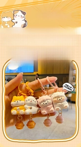 Detail view of cute resin animal keychains featuring Shiba Inu, cat, and sheep characters