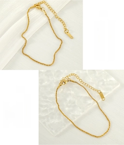 Detail of gold-plated stainless steel anklet showing extension chain and S.Steel logo tag