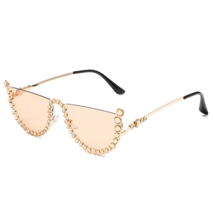 Fashion cat eye sunglasses with gold half-frame, brown lenses and diamond accents