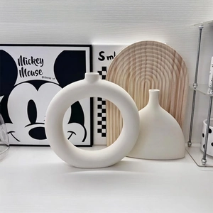 Modern white matte ceramic vase set with minimalist circular and organic shapes for decor